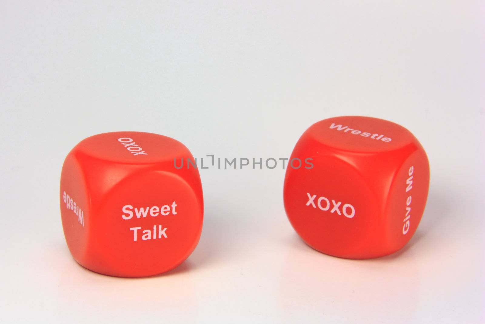 red cubes with chances to win love expression. on white