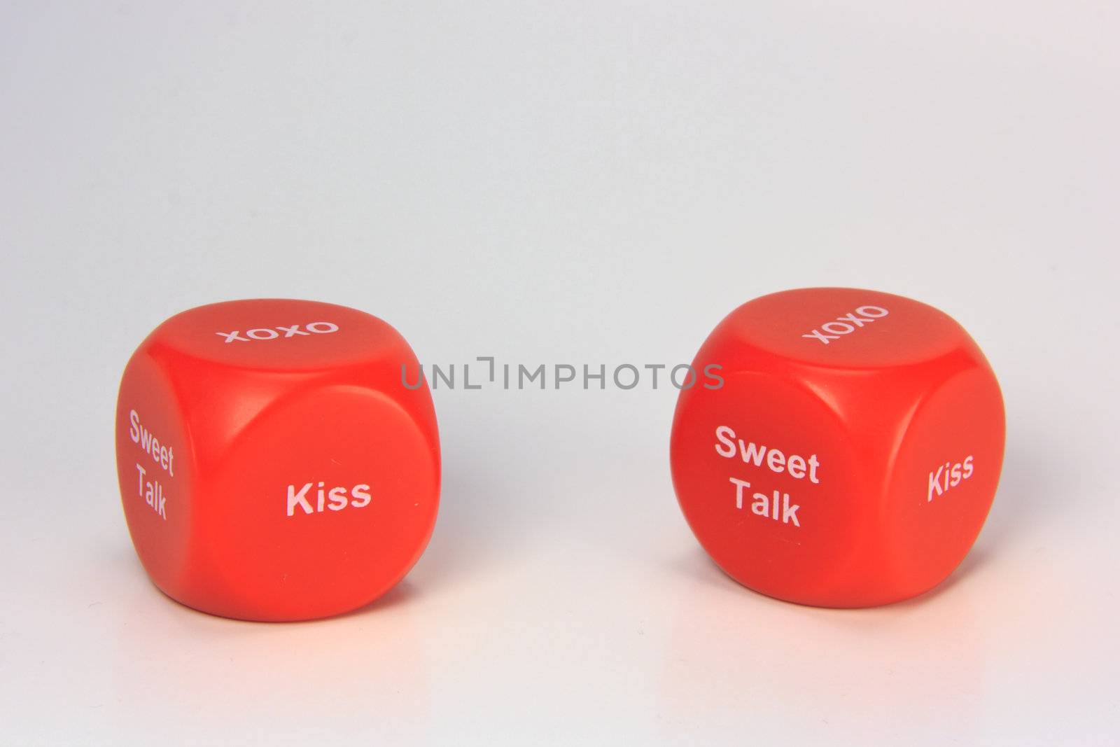 red cubes with chances to win love expression. on white