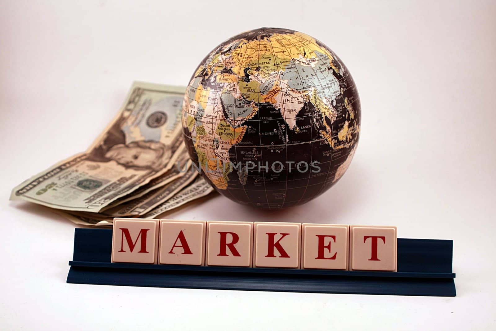 Global world market with globe and US currency. Isolated on white background.