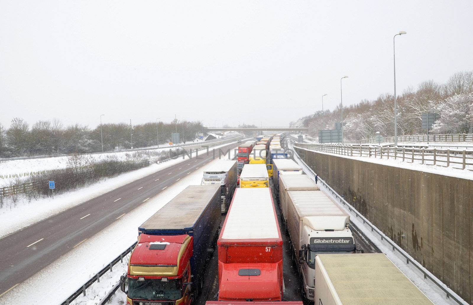 Lorries queue for as far as you can see on the m20 motorway in kent as operation stack takes effect after the channel crossings are cancelled