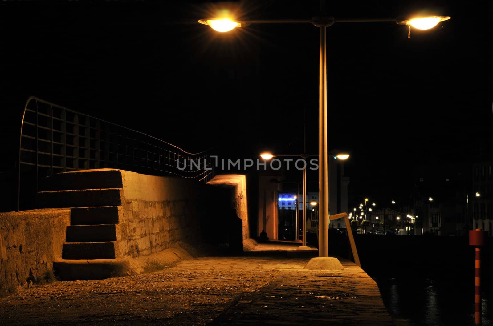 Jetty lights in the night in a little harbor