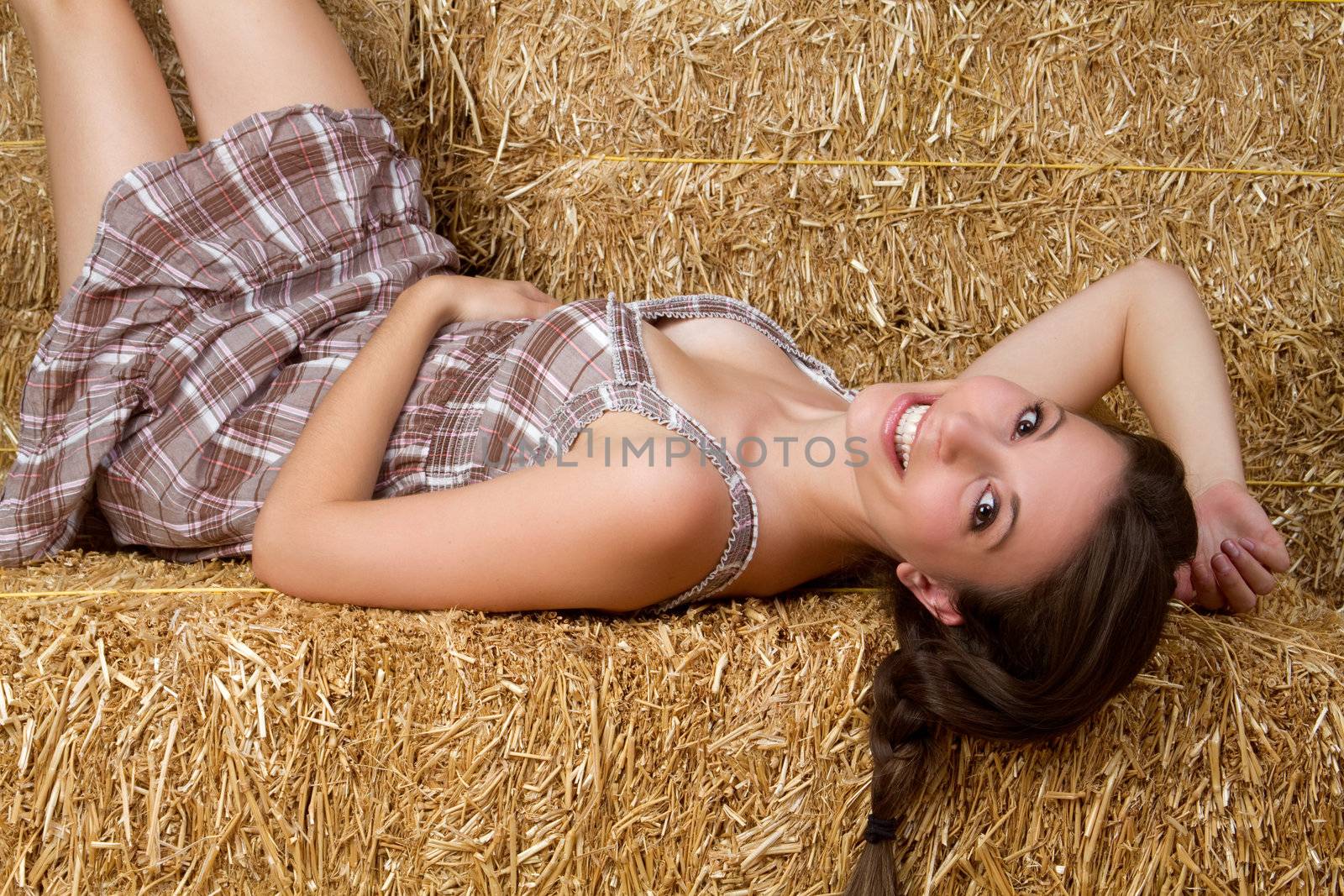 Pretty country girl in hay
