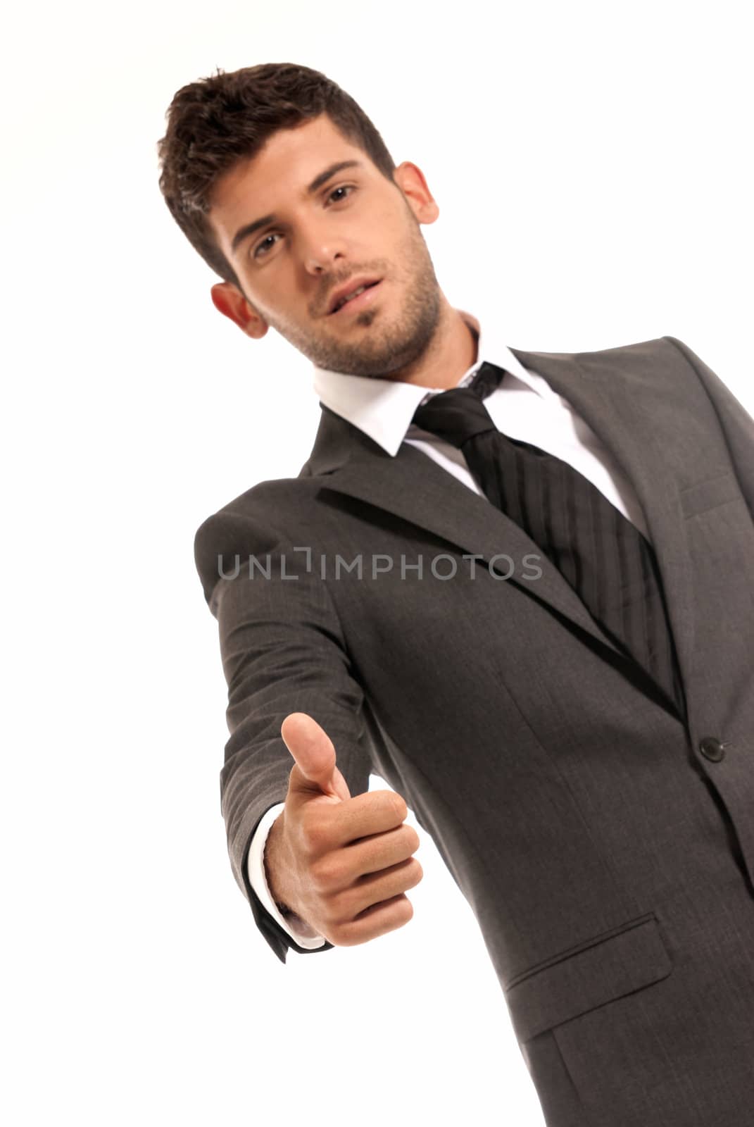 Young businessman ok symbol gesture, isolated on white background. Focused on hand
