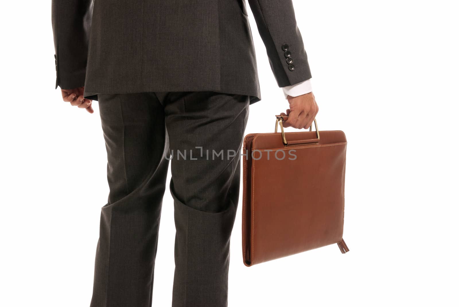 Unrecognizable businessman back with suitcase isolated on white background by dgmata