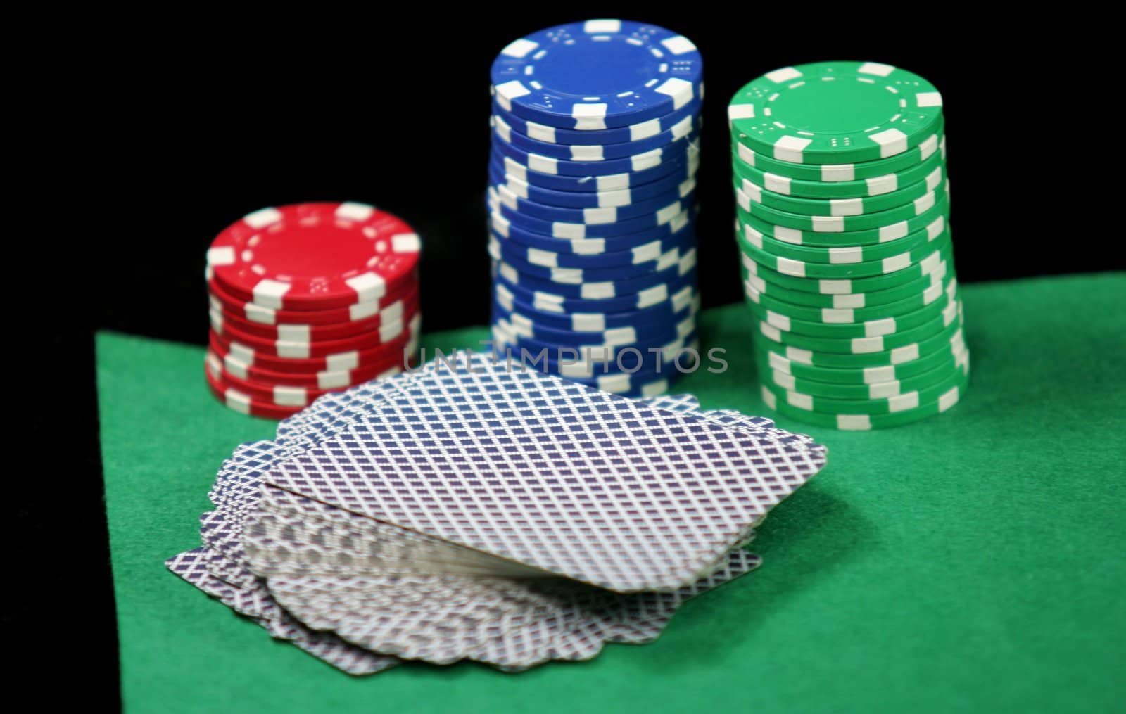 Poker and black jack, with isolated gaming objects, towards green