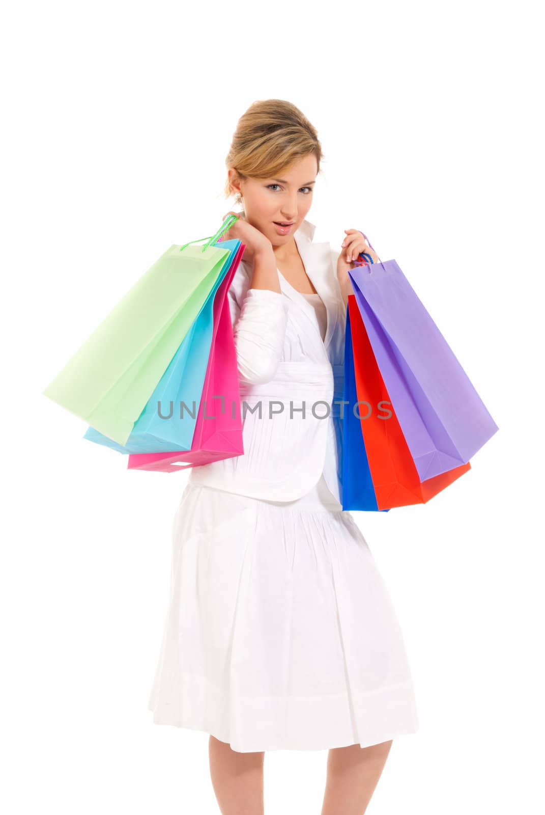 Young woman with shopping bags standing isolated on white background by dgmata