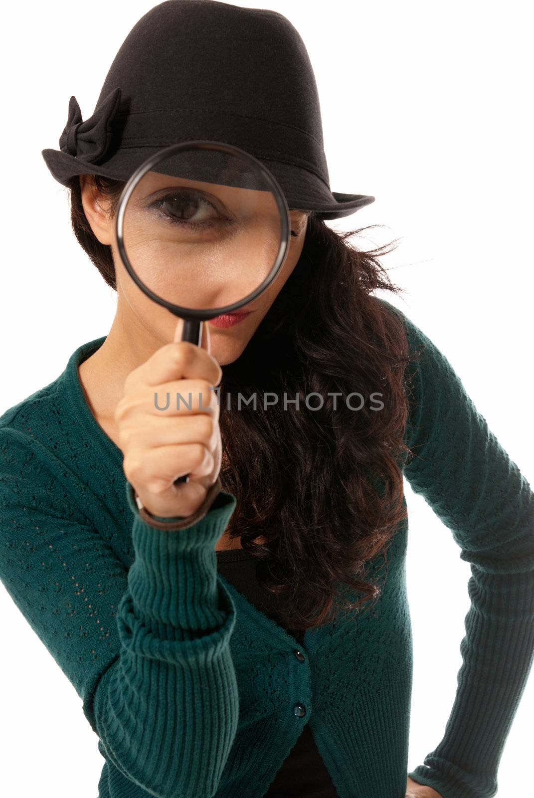Young woman looking through magnifying glass loupe detective isolated on white background by dgmata