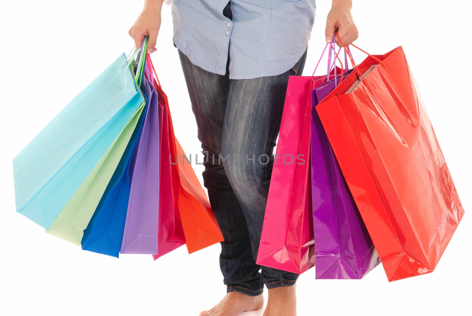 Unrecognizable woman with shopping bags isolated on white background