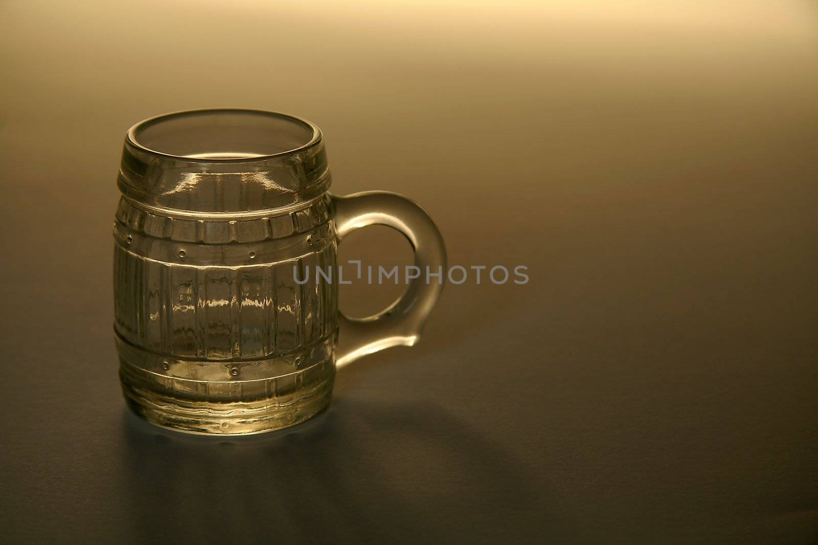 empty small bear glass on brown background