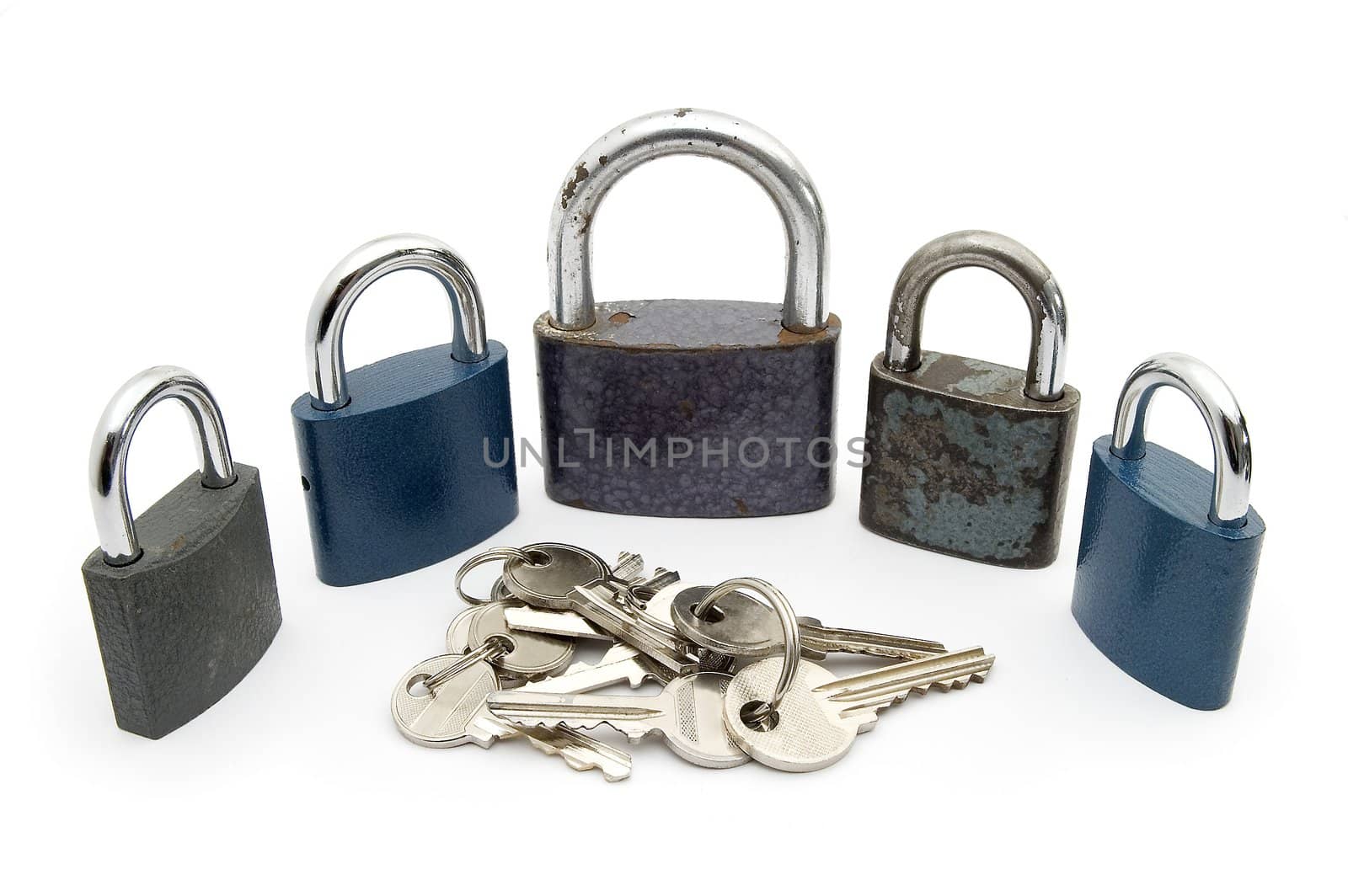 five locks and several keys isolated on white background