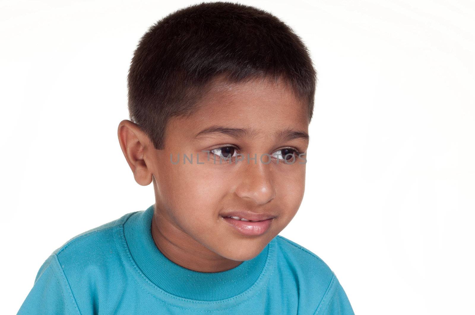 Photo of adorable young boy looking at camera