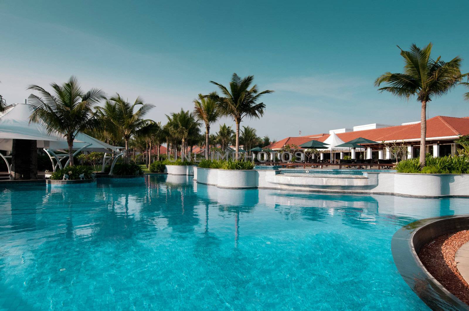 A beautiful large swimming pool at a local resort