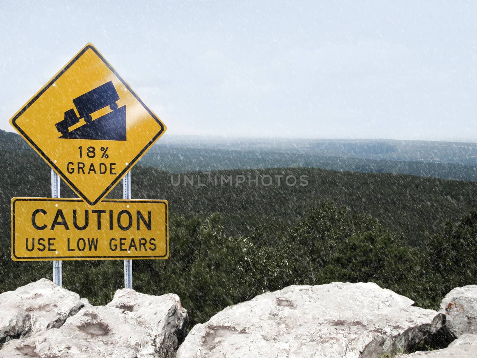           
Caution Use Low Gears truck warning at mountain top during snow storm.