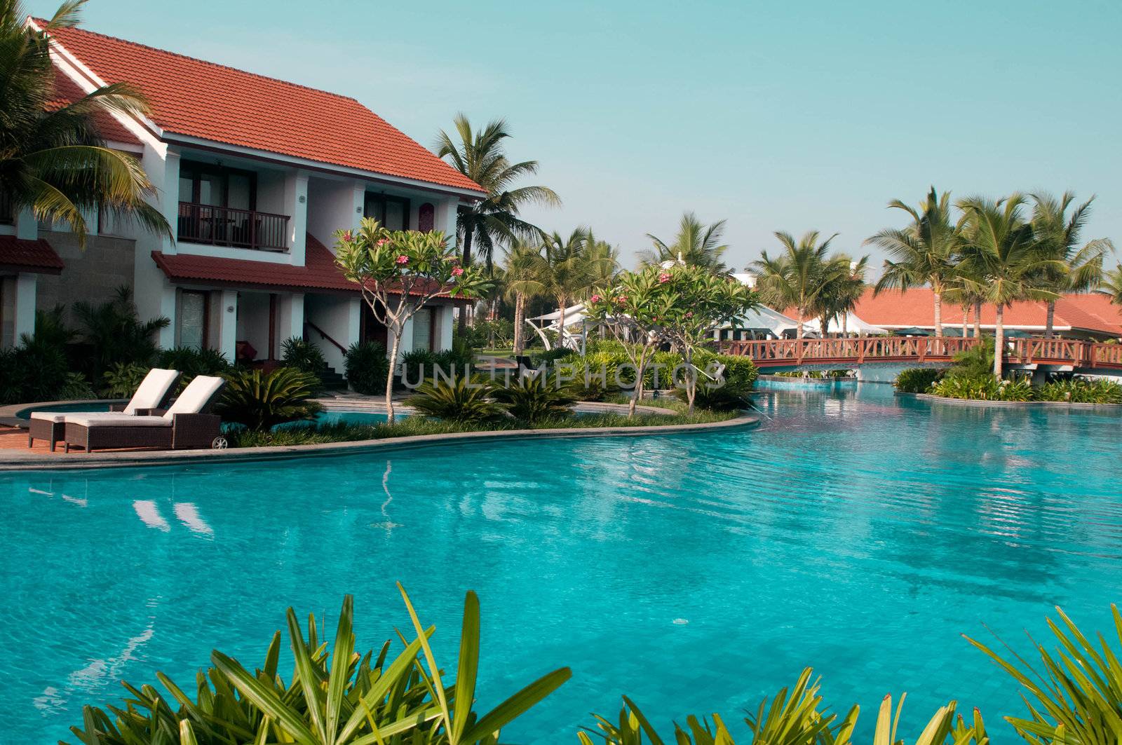 A beautiful large swimming pool at a local resort