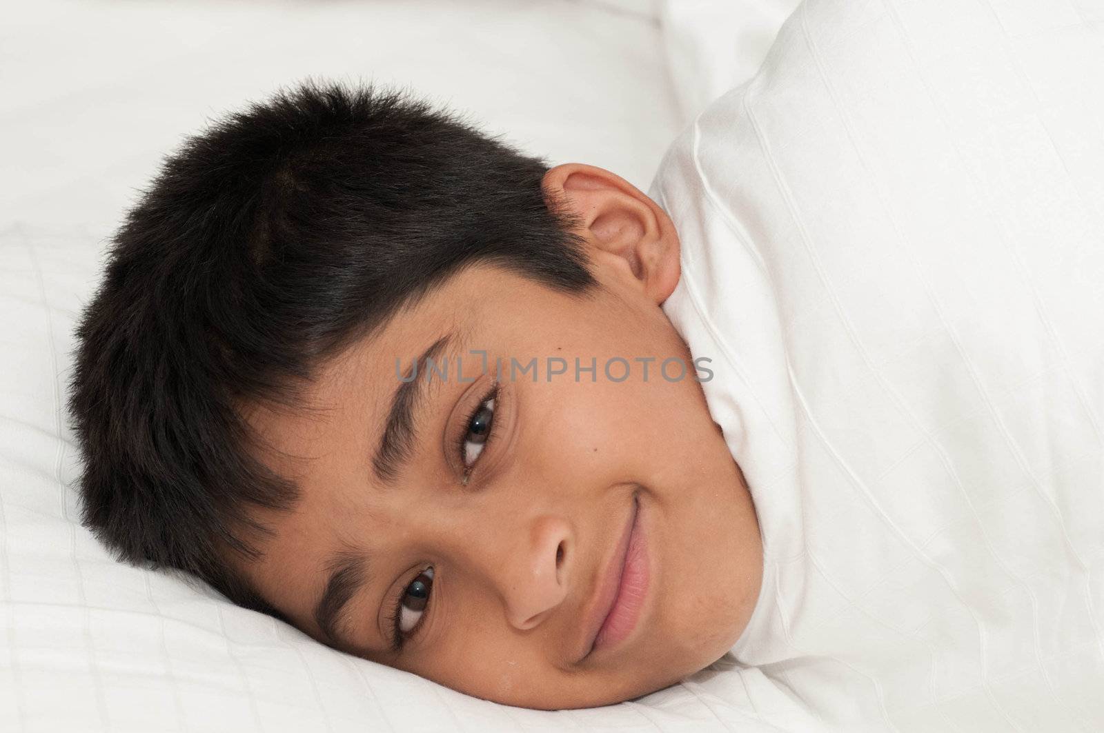 A handsome indian kid smiling for you