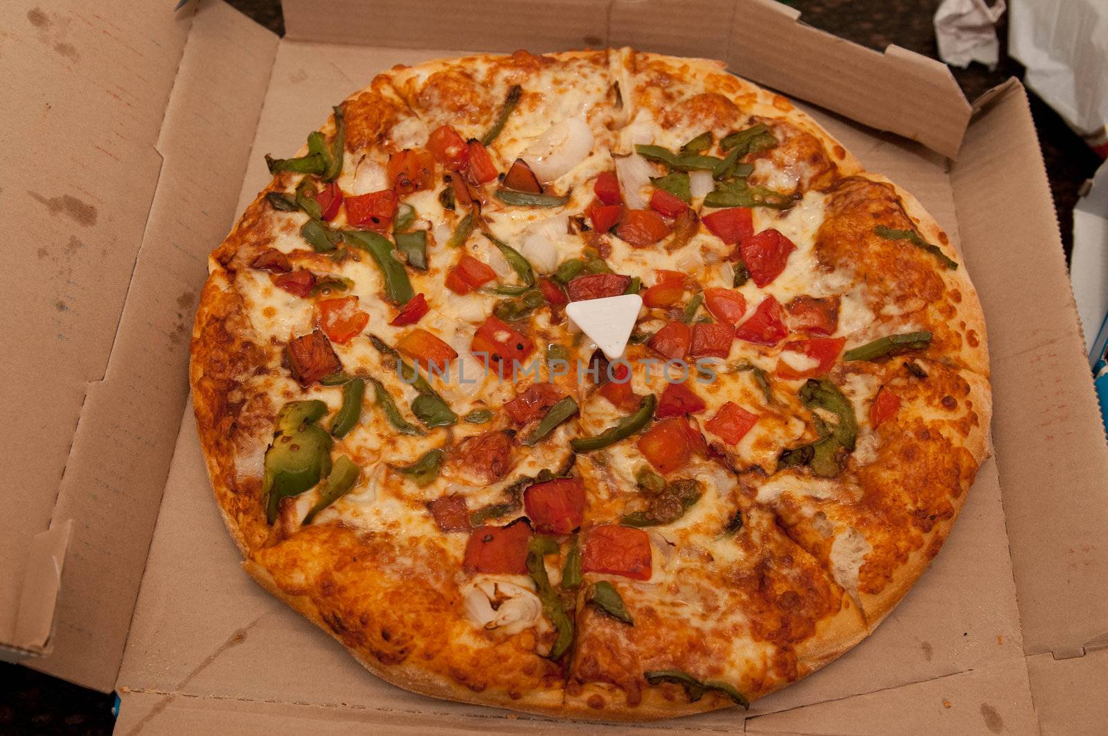Close up photo of a fresh vegetable pizza