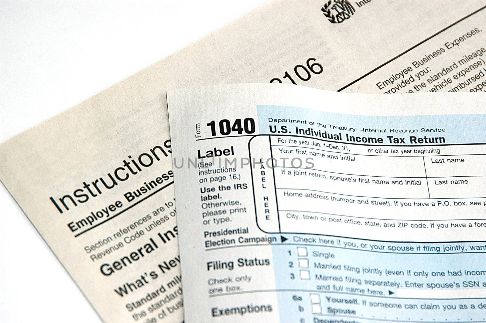 Hand signing a tax form concept of filing tax