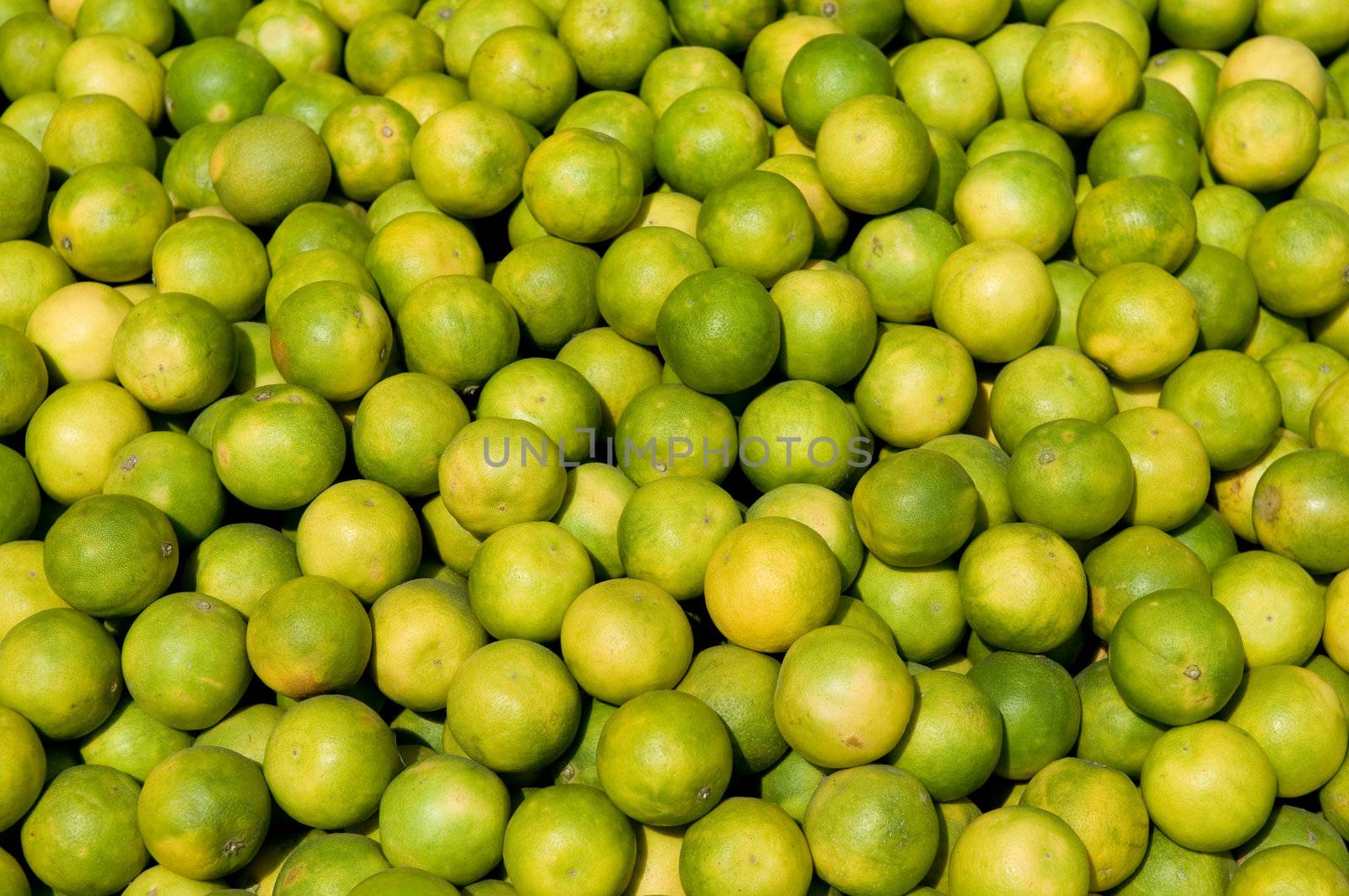 Freshly grown lemon produce at a local fruit market by pazham