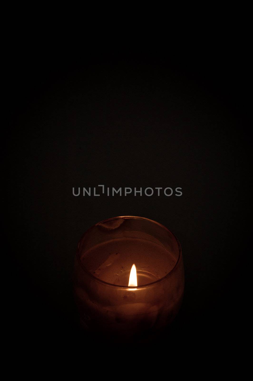 A candle providing light to brighten darkness