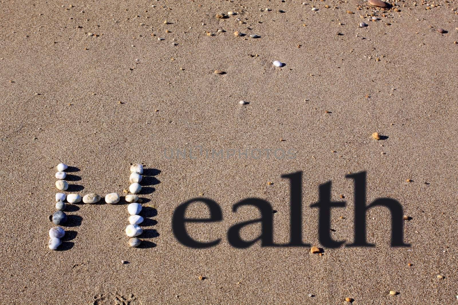 An upper cased letter 'H' formed by beach pebbles on the sand. The word health is spelt out by the addition of shadowed text.