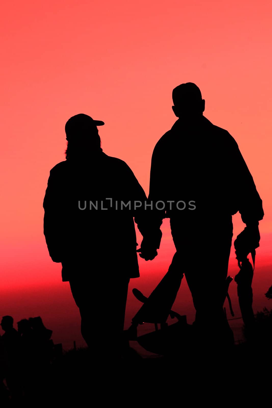 A couple enjoying sunset at the Bay bridge