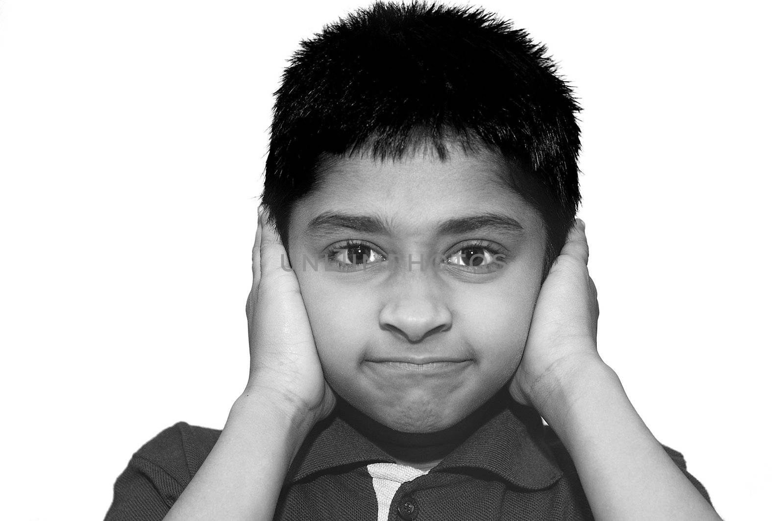 An handsome Indian kid looking very stubborn