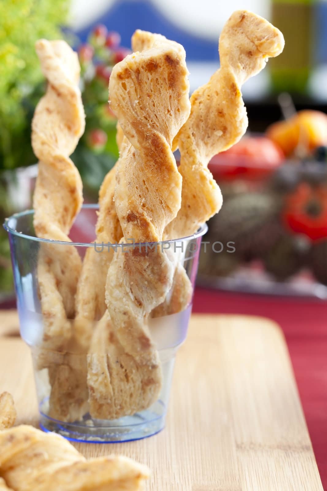 Dutch cheese sticks, kaastengels, in blue cup.