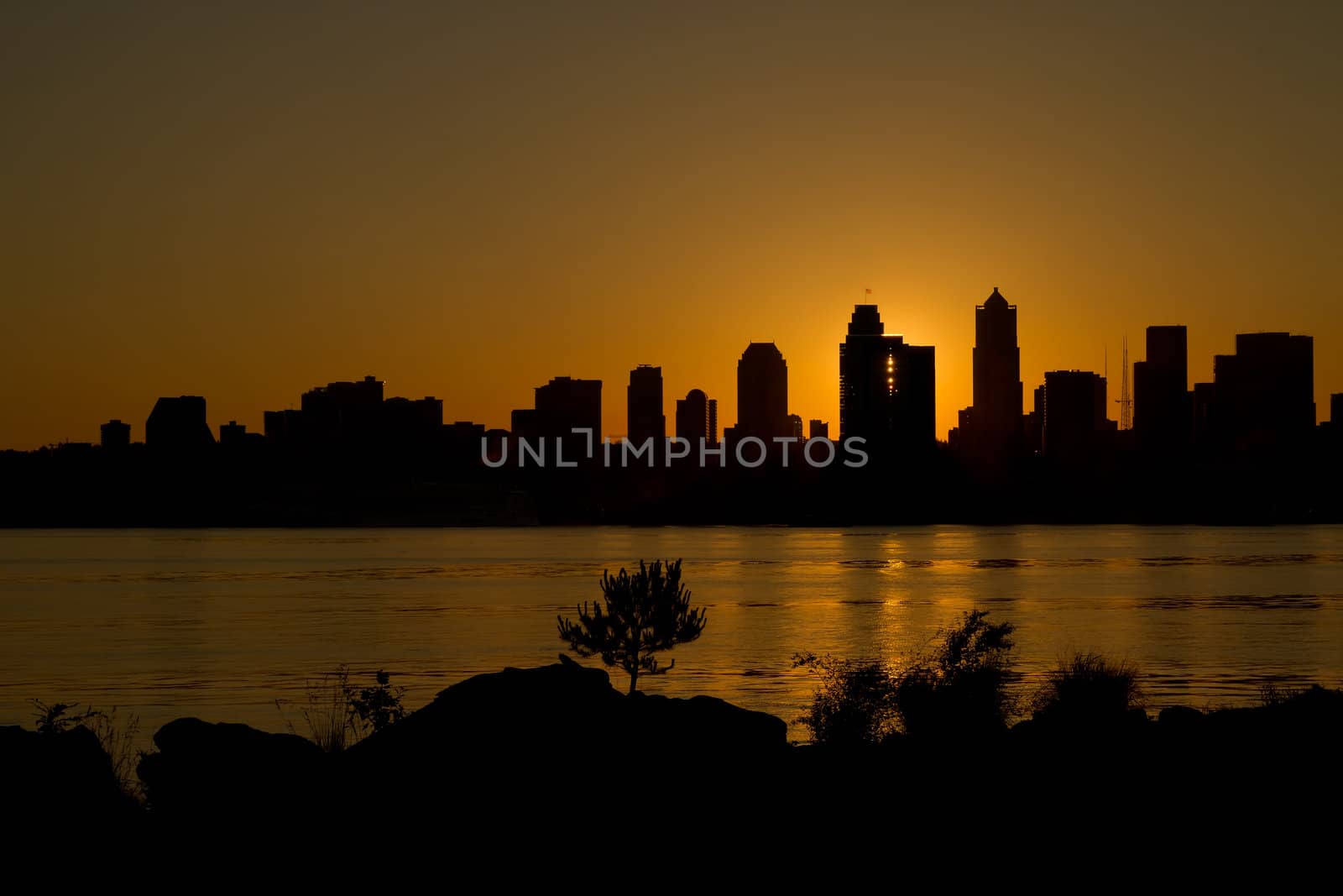 Sunrise over Seattle Washington Skyline Along Puget Sound from Alki Beach