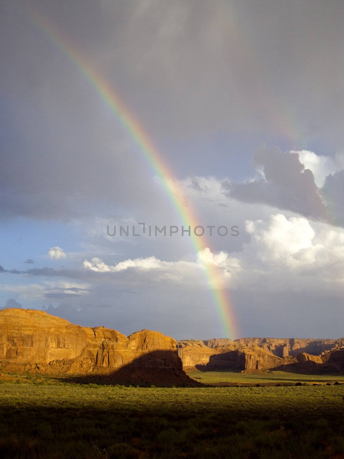 Double rainbows appear after sudden desert storm