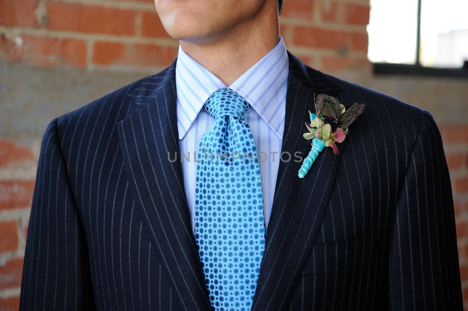 Image of a Blue Pinstriped Suit with Tie and Boutonniere