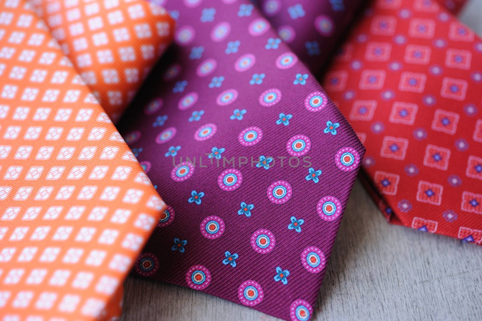 Image of 3 ties on white wood background