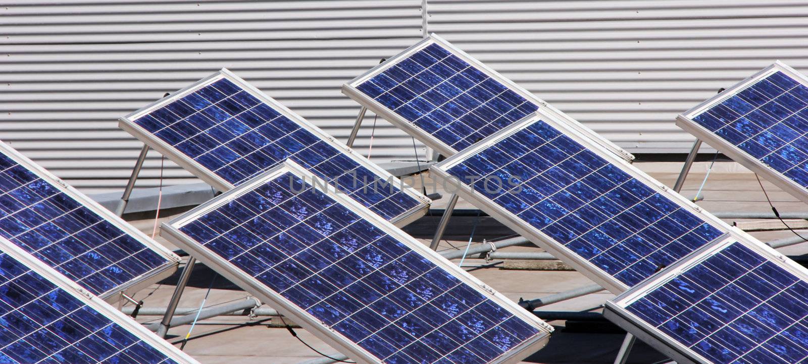 System of many blue solar panels on the roof