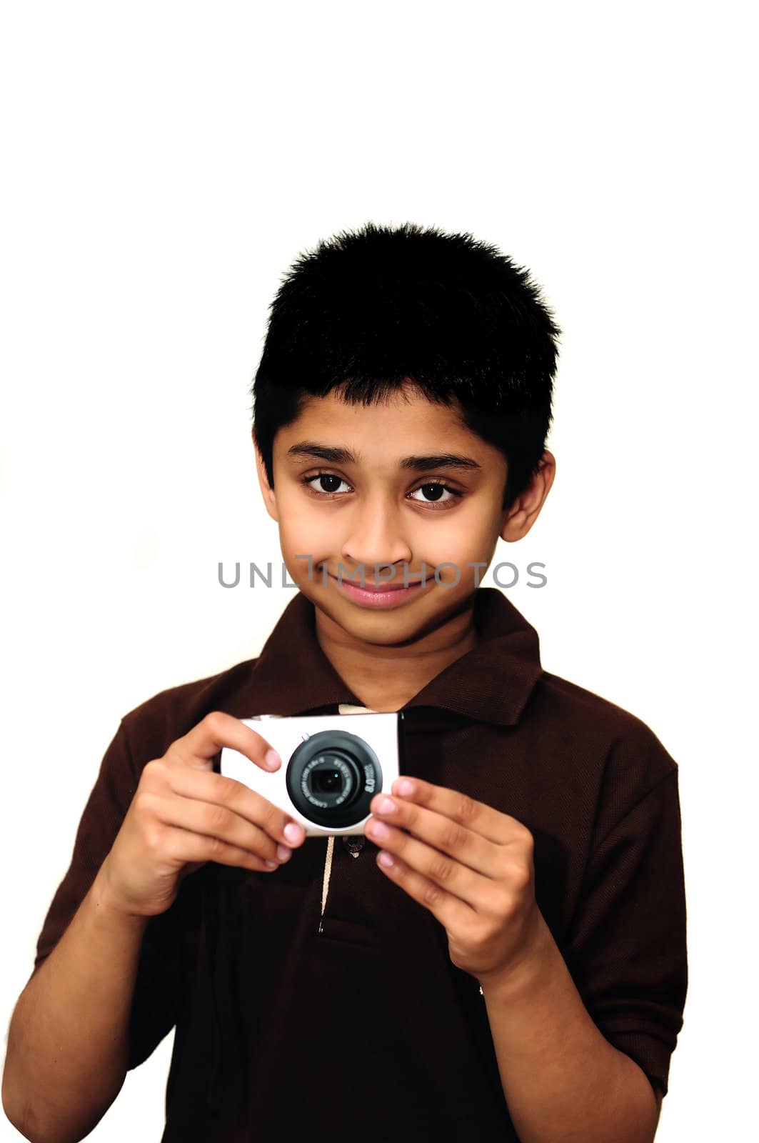 An handsome Indian kid taking photoa with a digital camera
