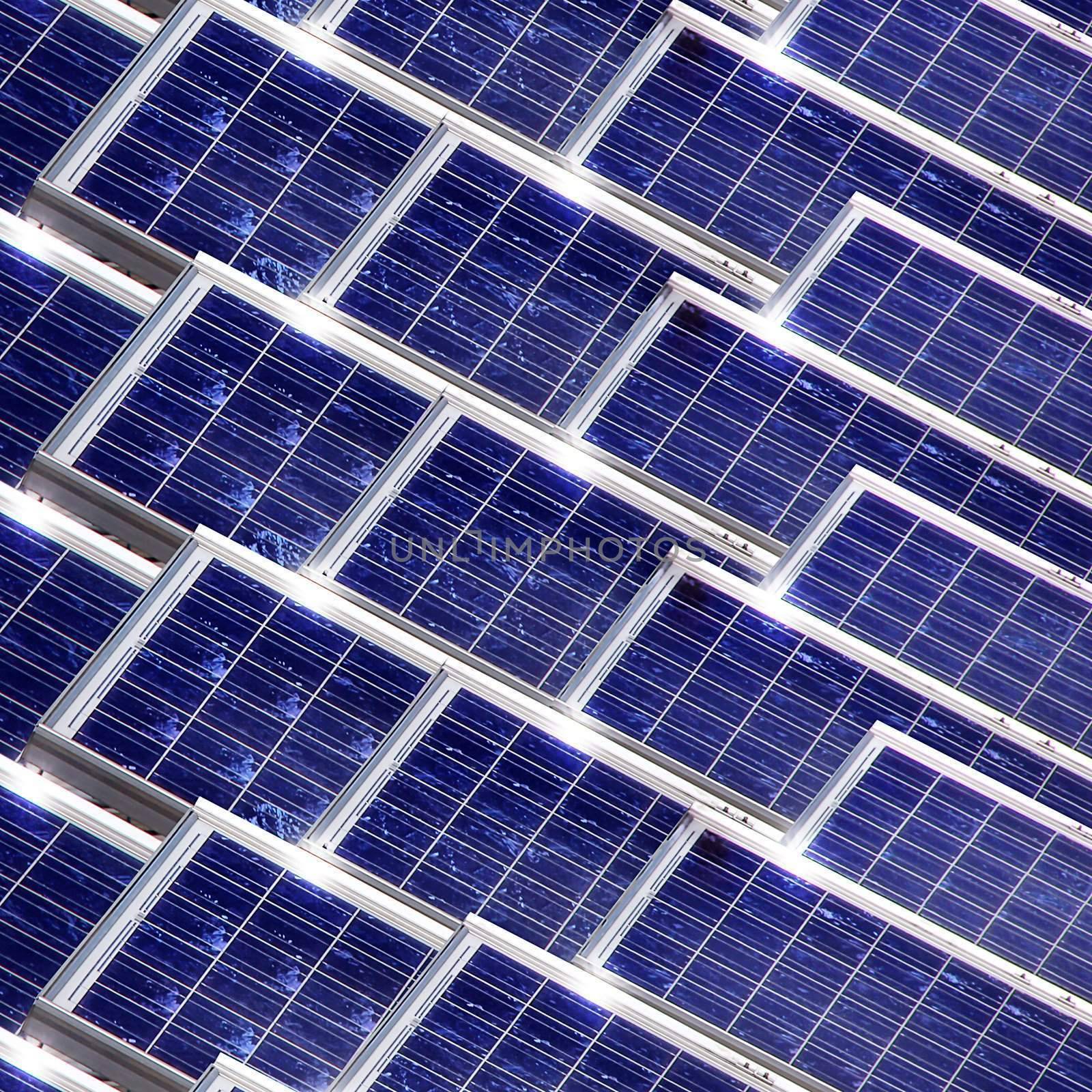 System of many blue solar panels on the roof