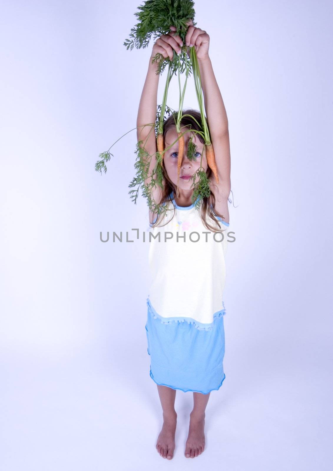 A little girl holding in her hand a beautiful flower