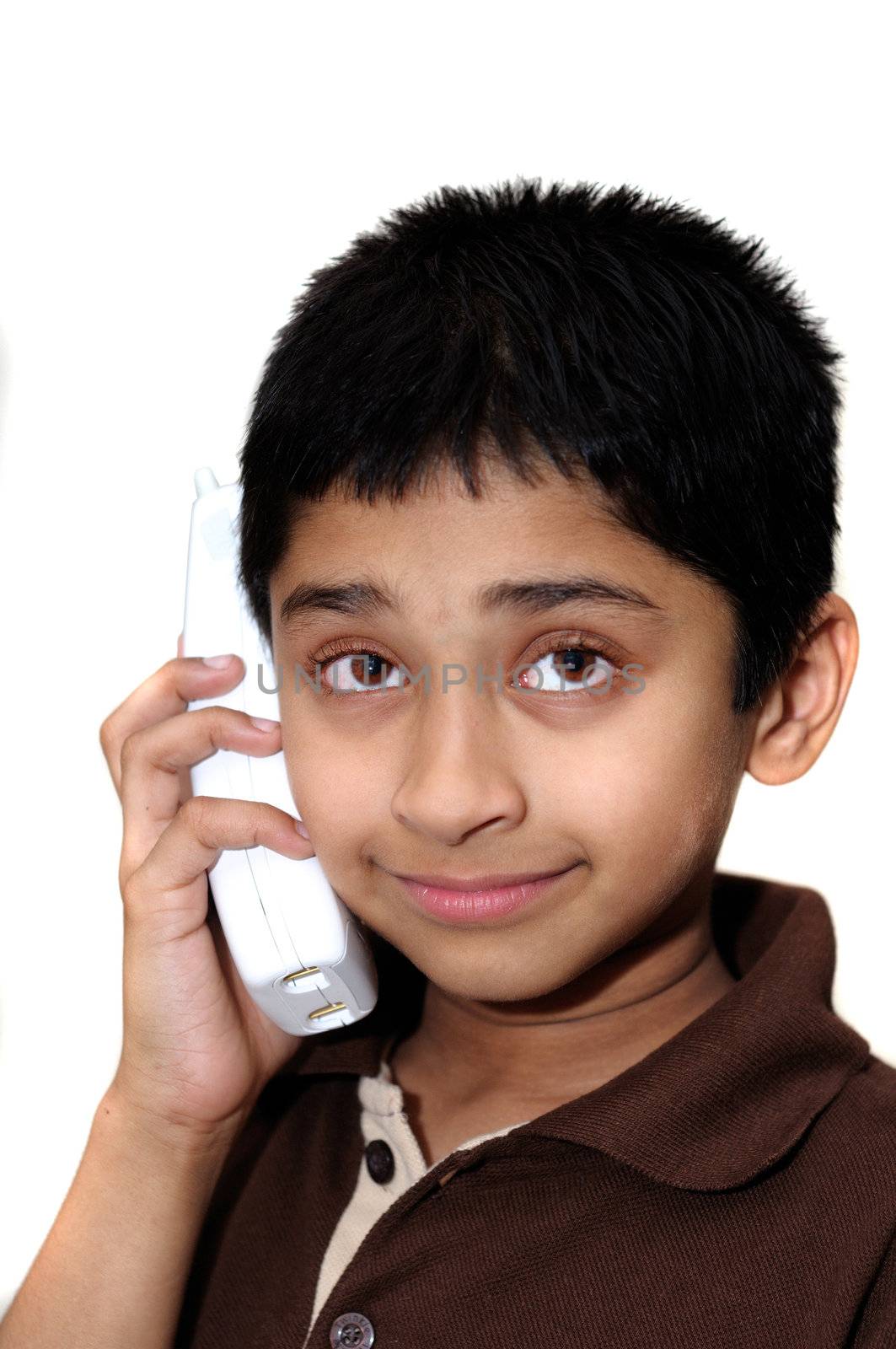 An handsome Indian kid having a conversation on the phone
