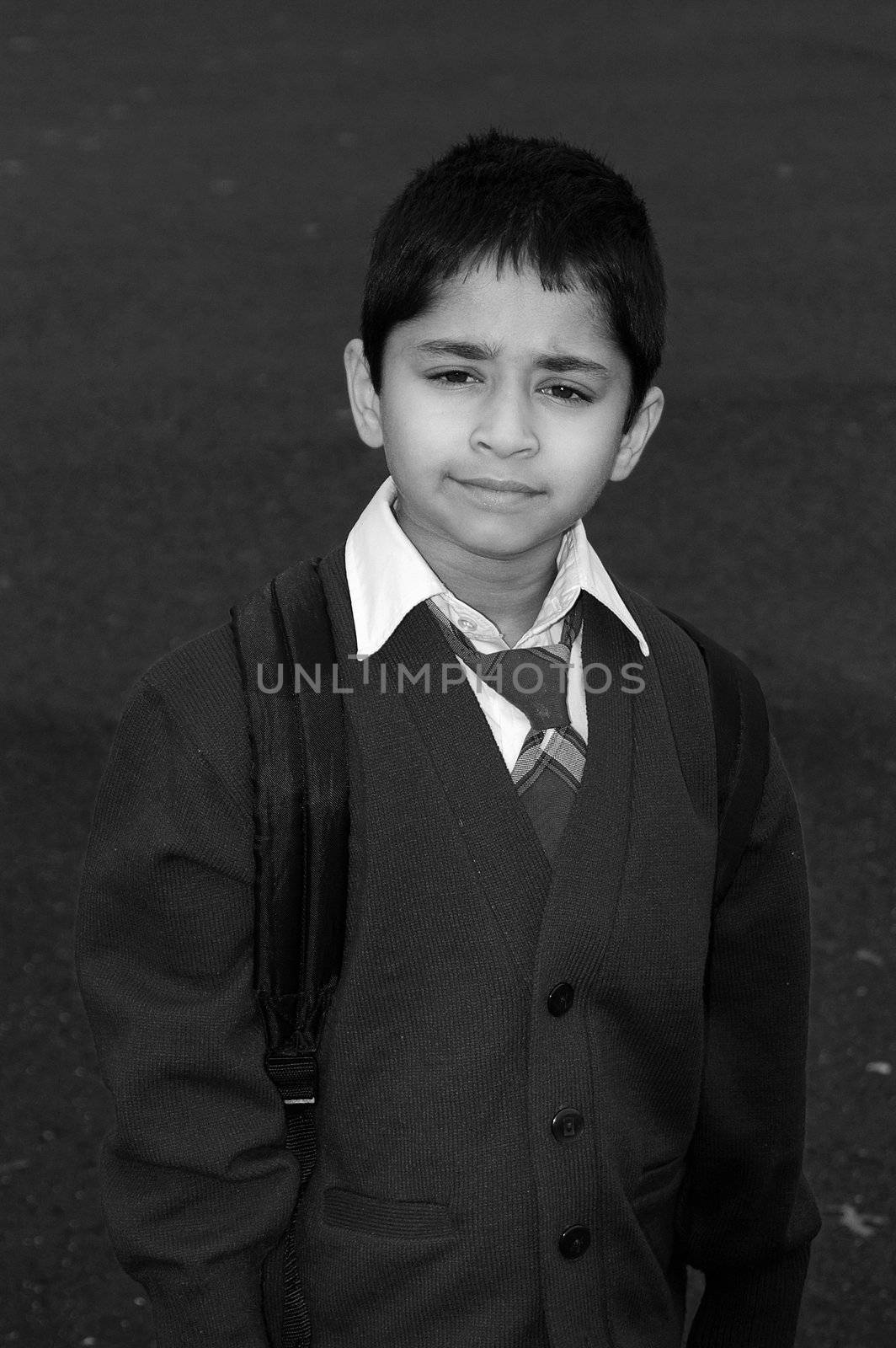 An handsome kid getting ready to go to school