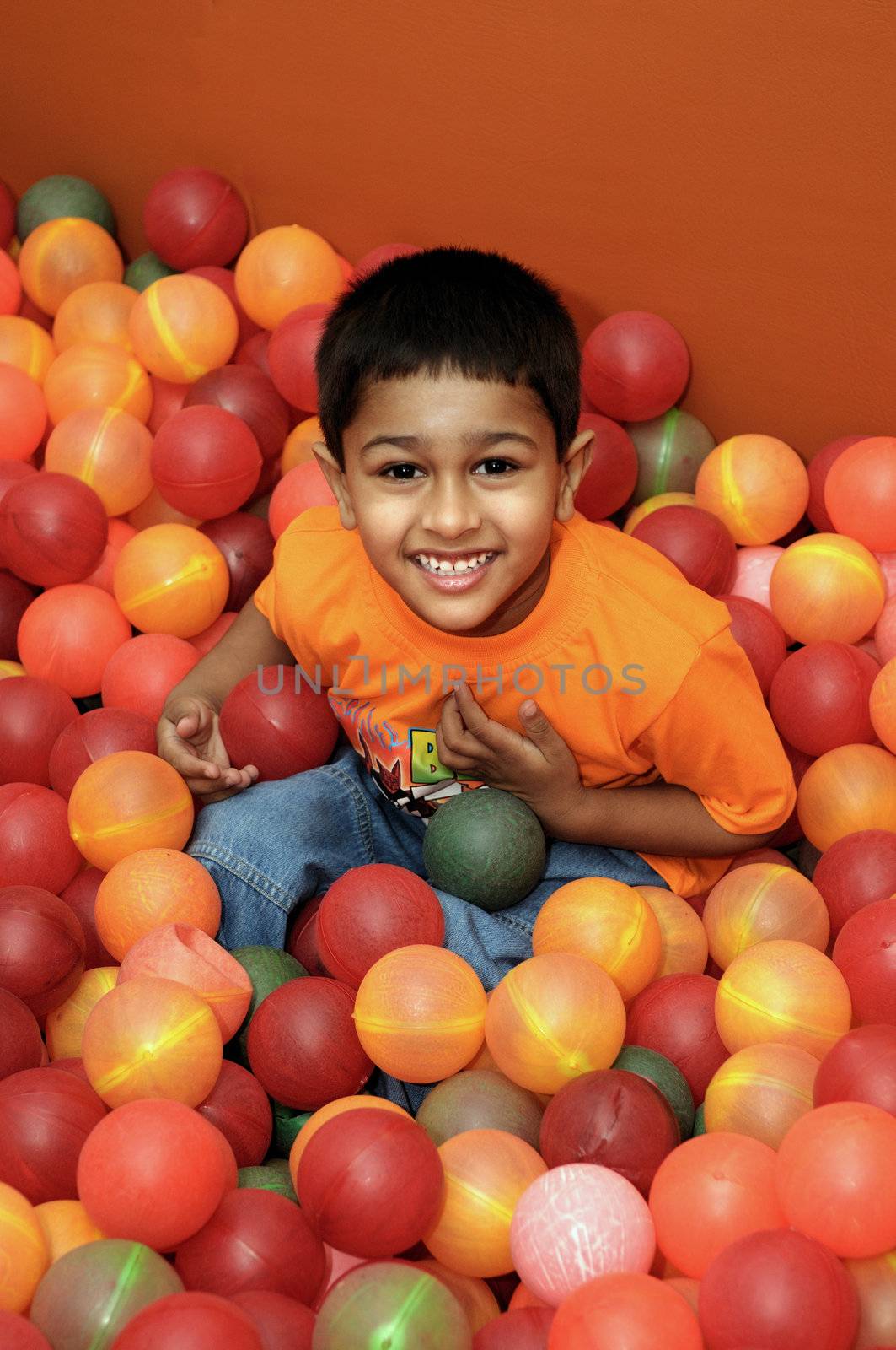 An handsome Indian kid having fun at a birthday party
