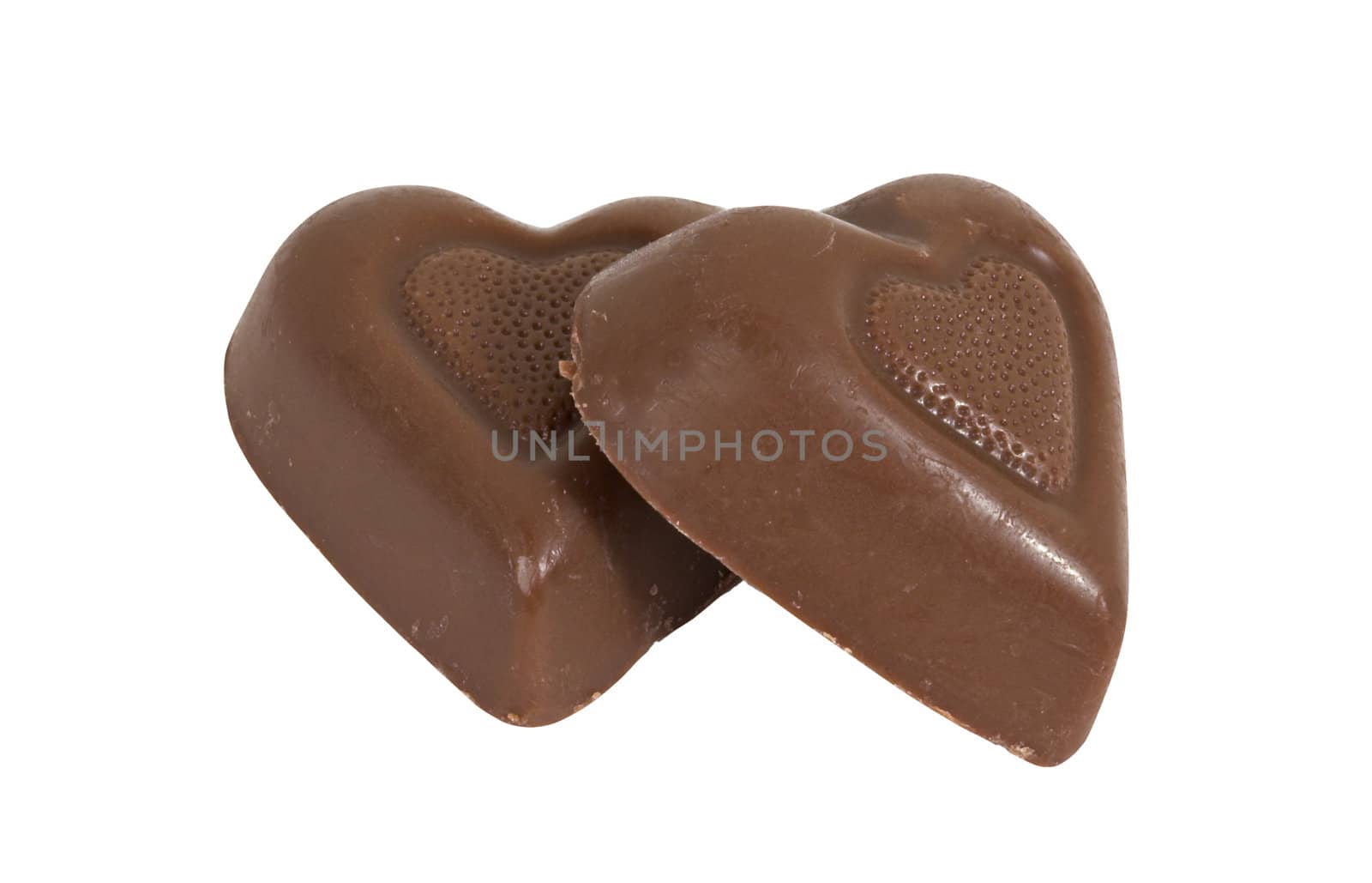 Two chocolate candy hearts isolated over a white background