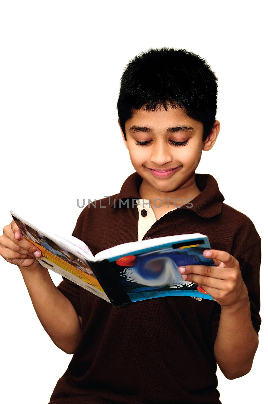 An handsome Indian kid enjoying reading books