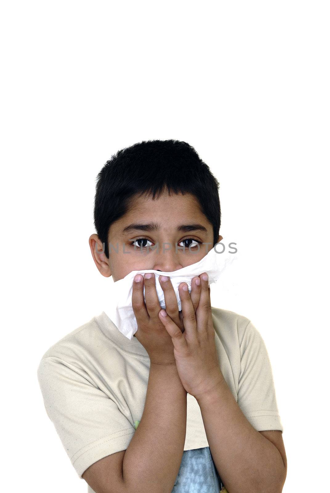 An handsome Indian kid wiping his face due to an allergy