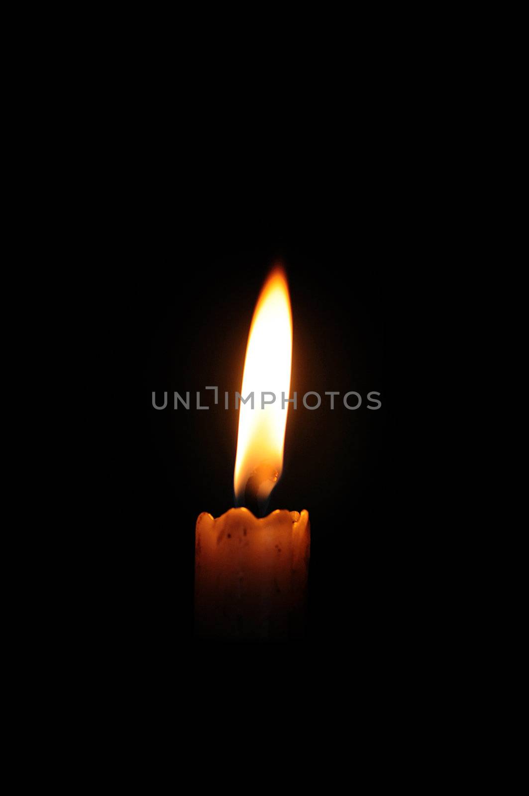 Glowing candle symbol of peace and happiness