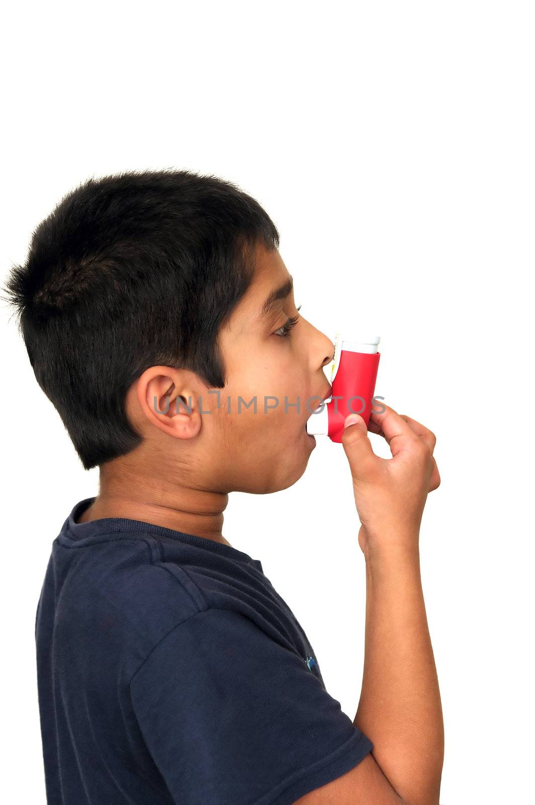 An allergic kid taking medicine thru inhaler