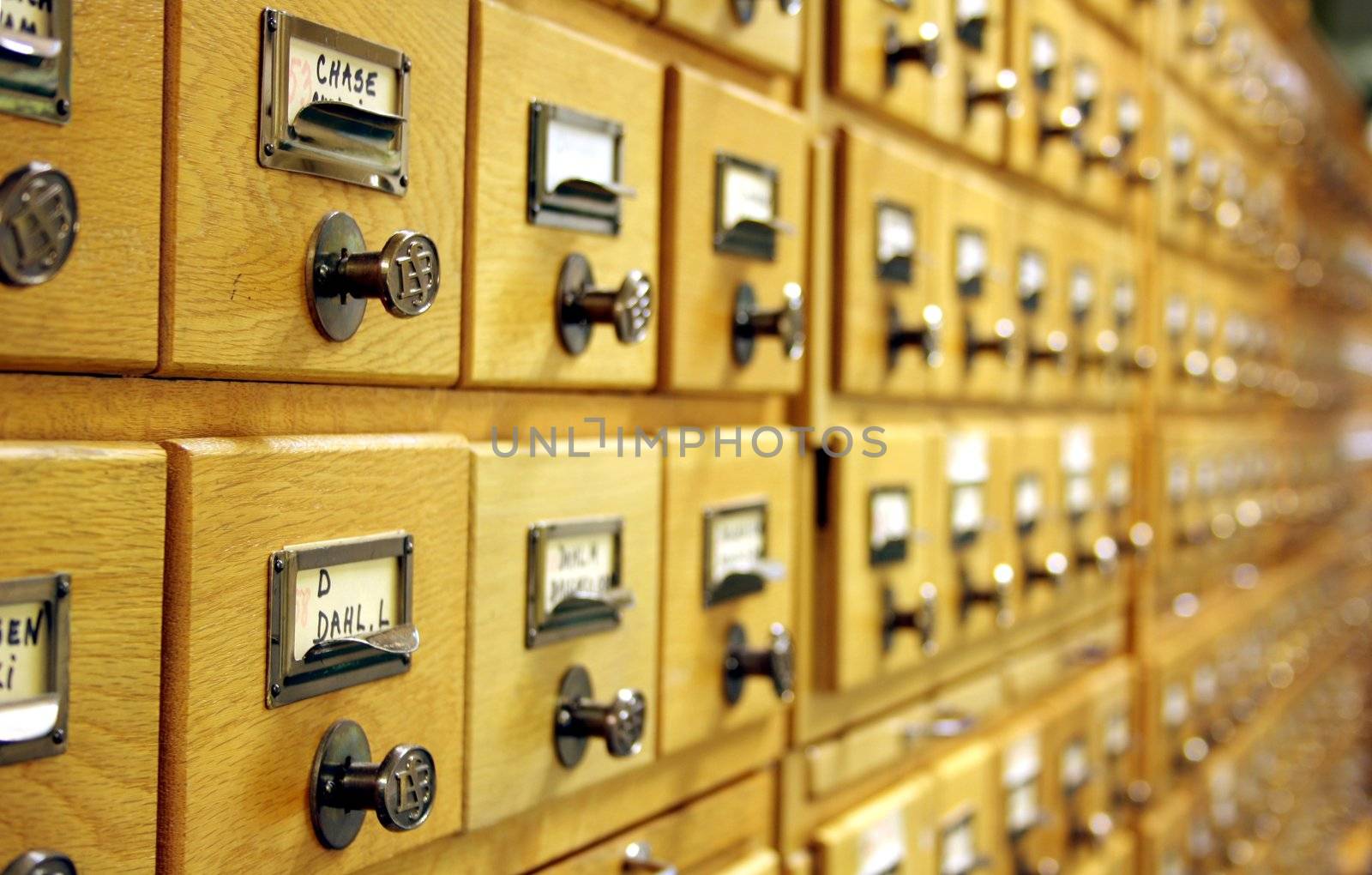 Closeup of card catalogue, showing several drawers
