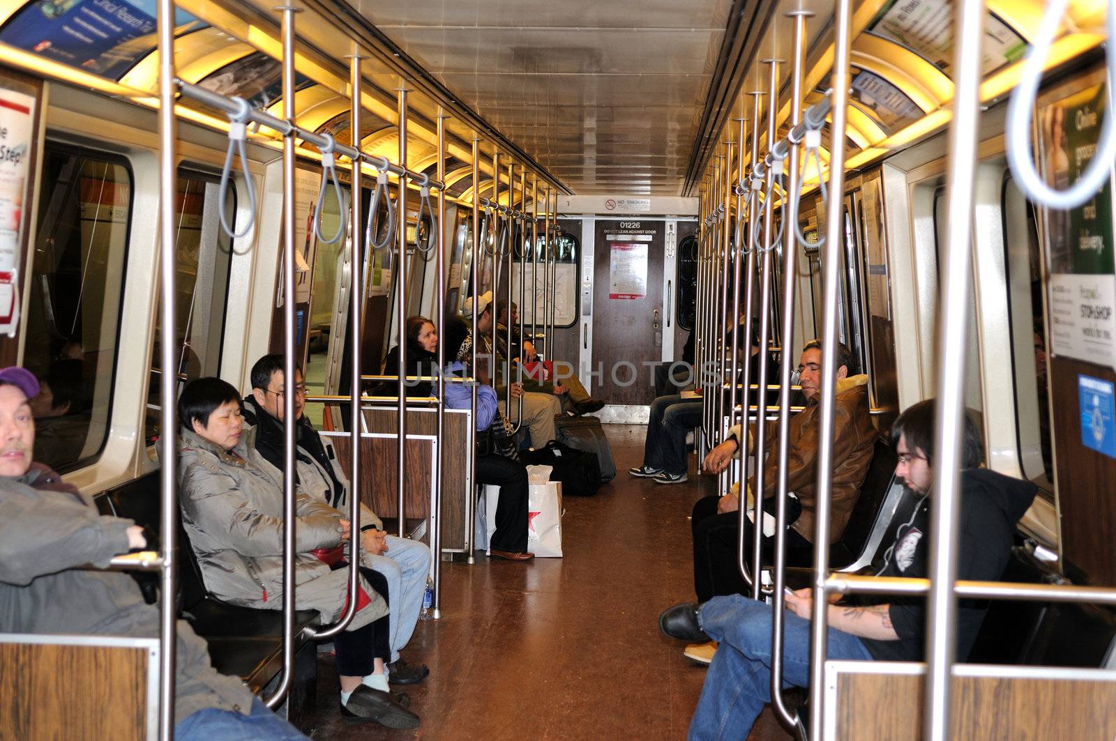 Lots of people travelling in a city metro train