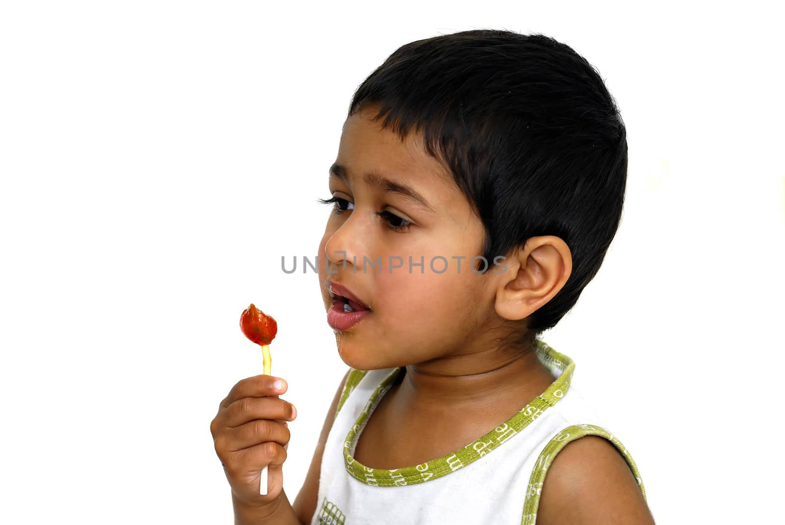An young handsome kid with his lollypop