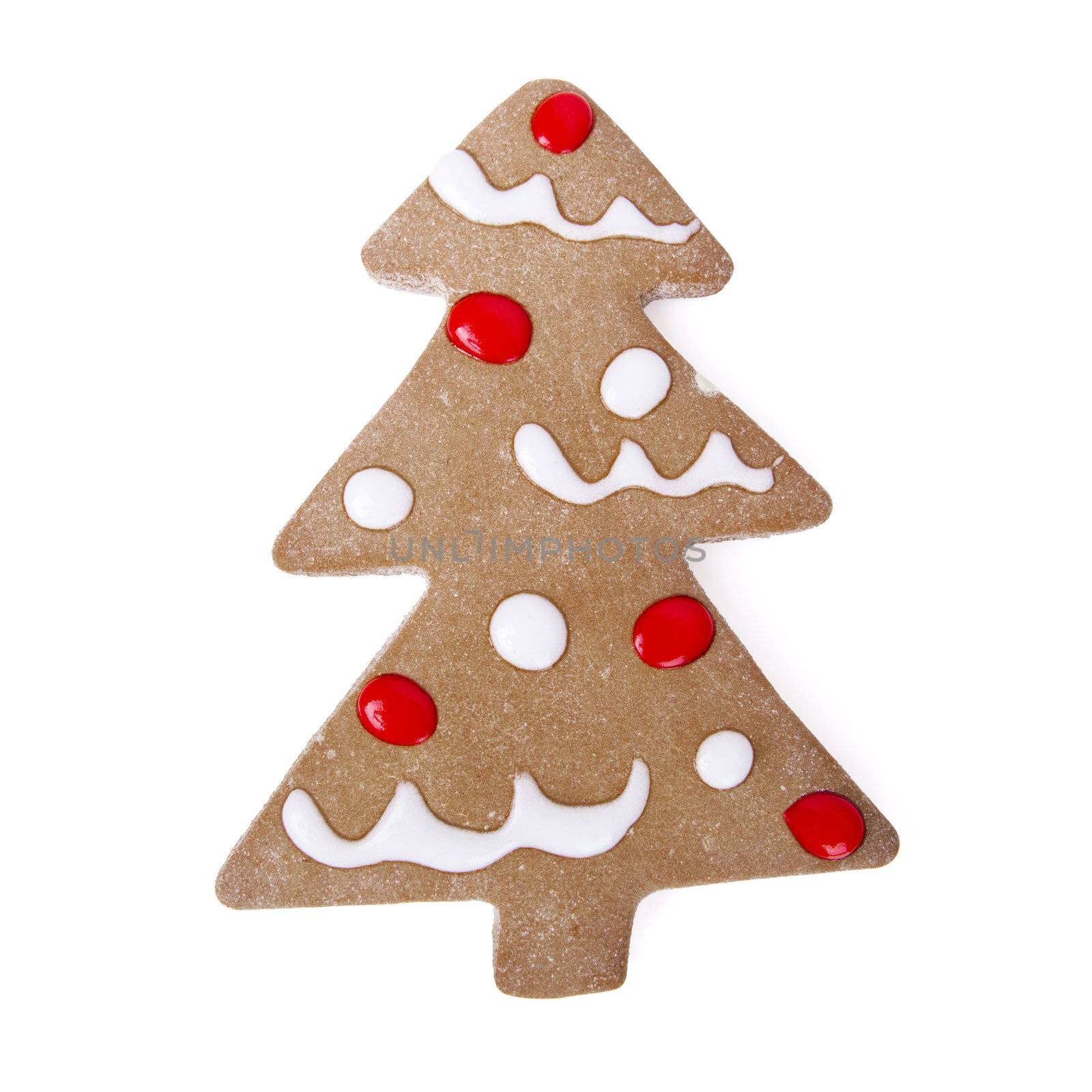 Homemade Gingerbread christmas cookies with a shape of a tree isolated on white