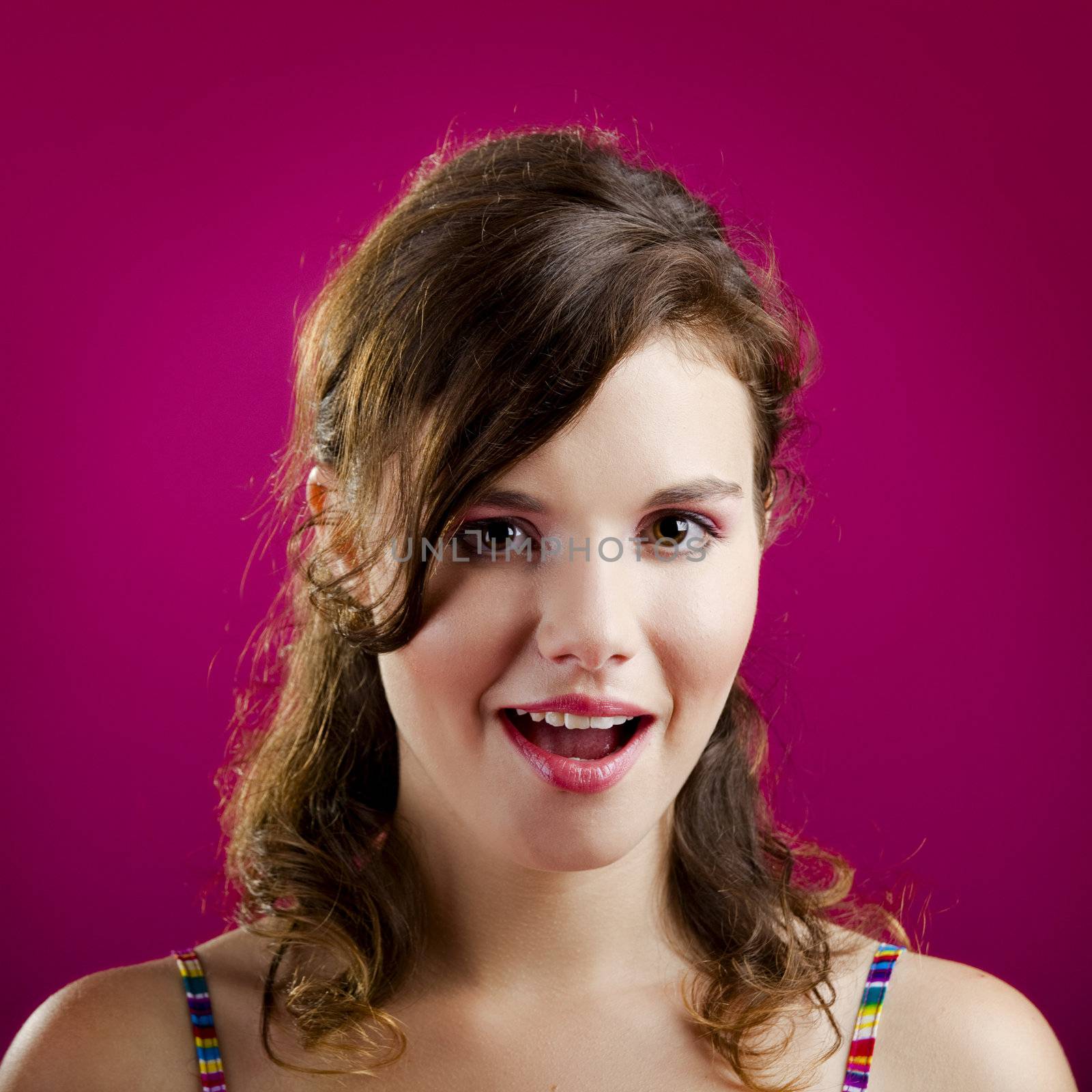 Portrait of a beautiful young woman with a expression of surprise