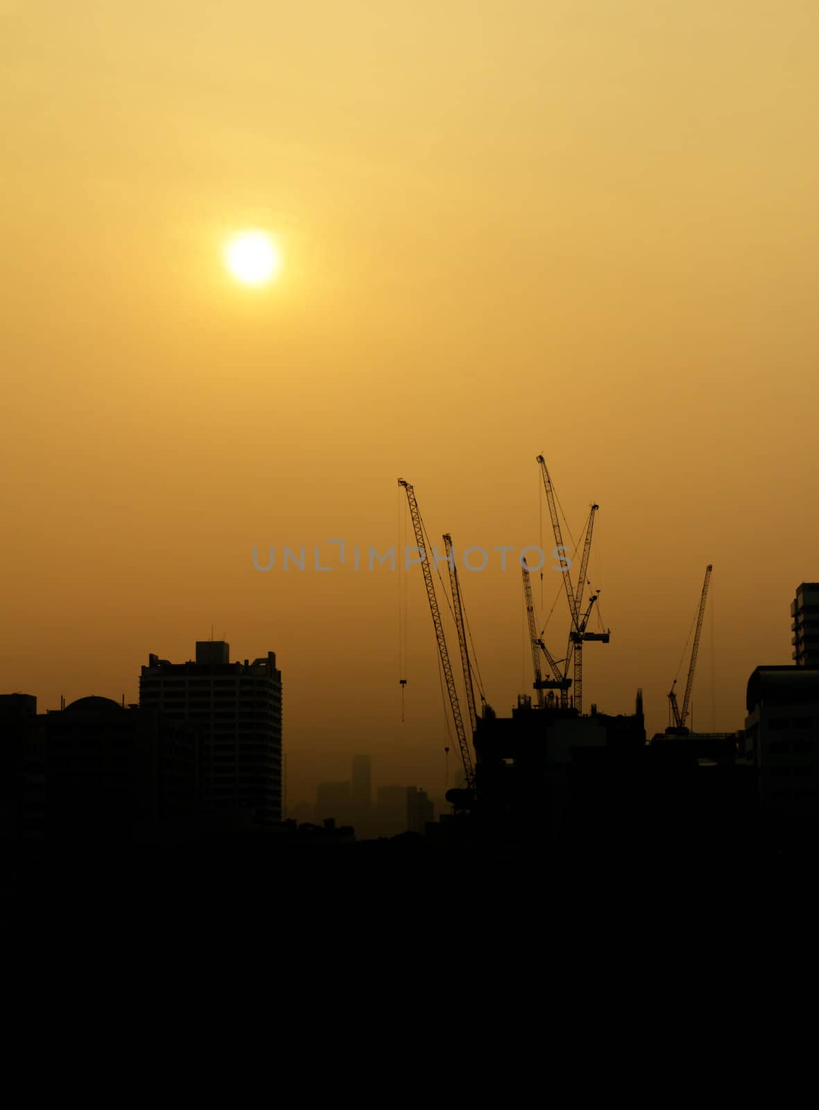 City under construction at sunrise silhouette