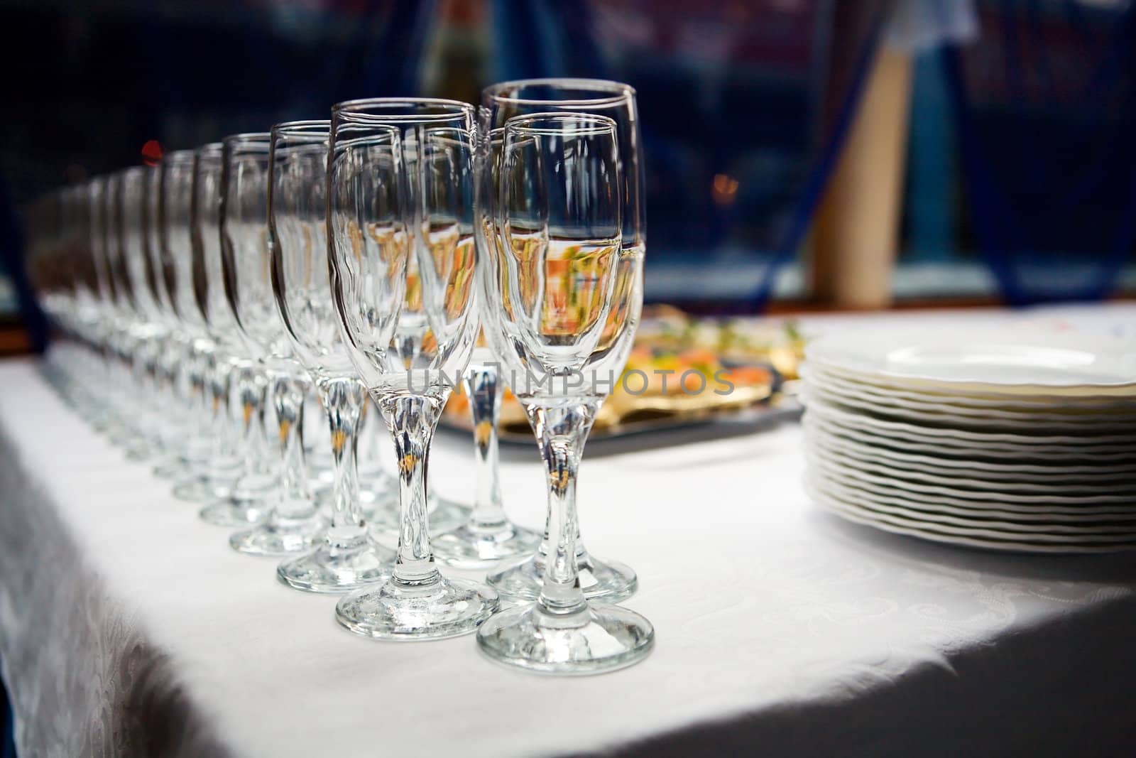 Empty Glasses and plates on restaurant table before party begins